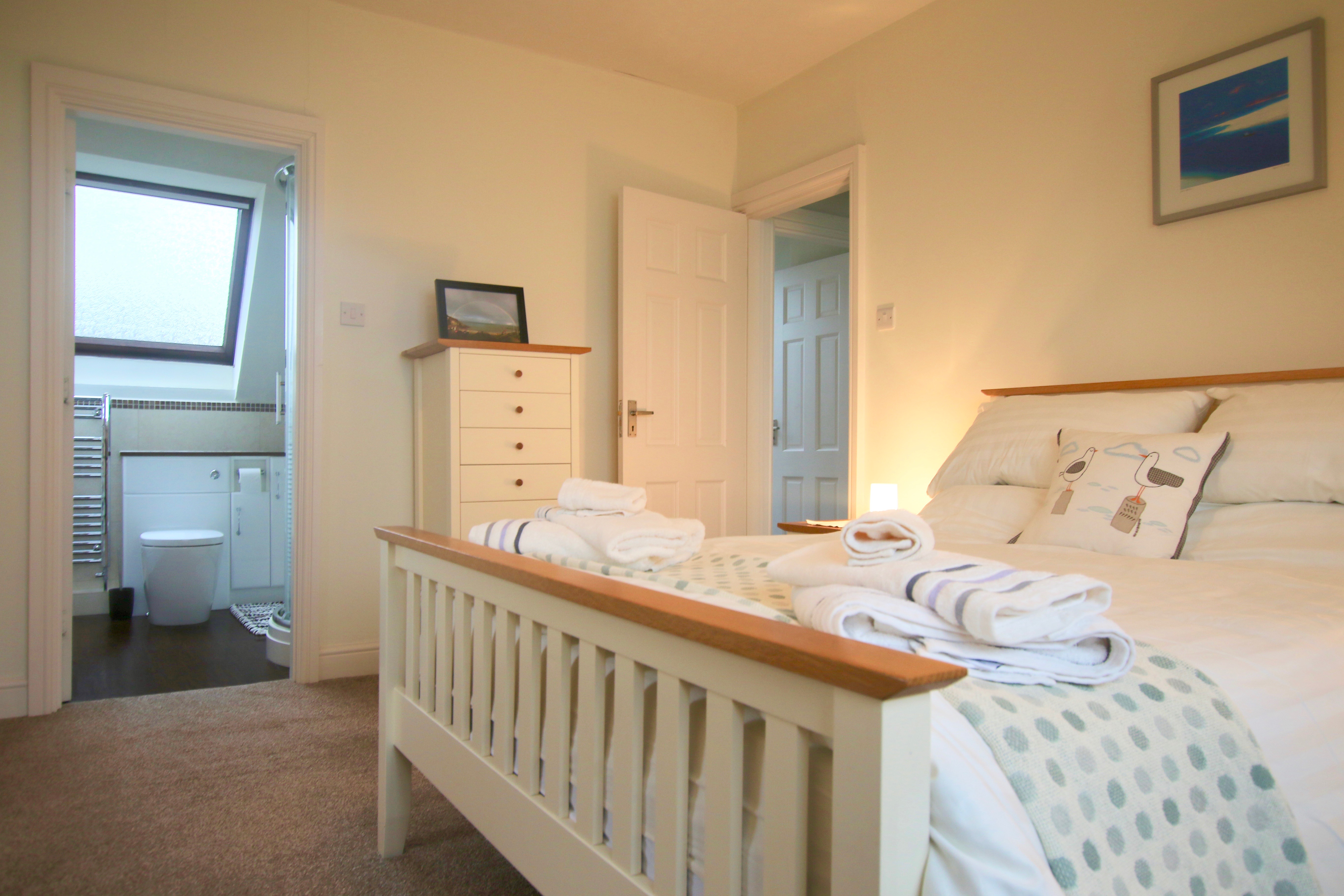 Master bedroom with en suite of beach facing west wales cottage